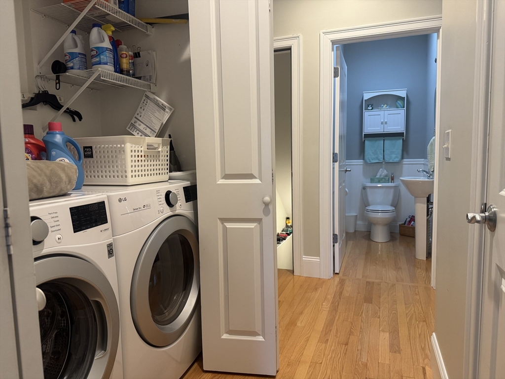 9 Hathaway Pond Circle, Unit 9 Rochester, MA 02770 - Photo 36 of 38 a view of a hallway with washer and dryer