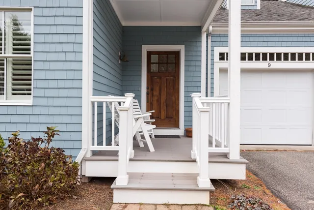 a view of a livingroom with furniture and stairs