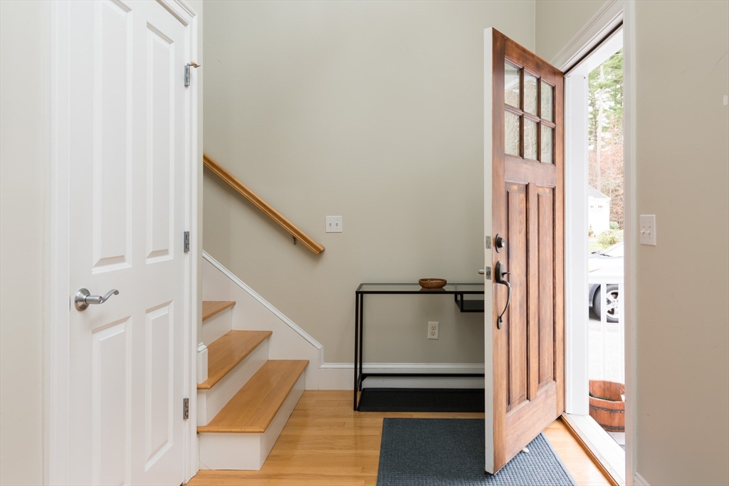 9 Hathaway Pond Circle, Unit 9 Rochester, MA 02770 - Photo 6 of 38 a view of a livingroom with furniture and stairs