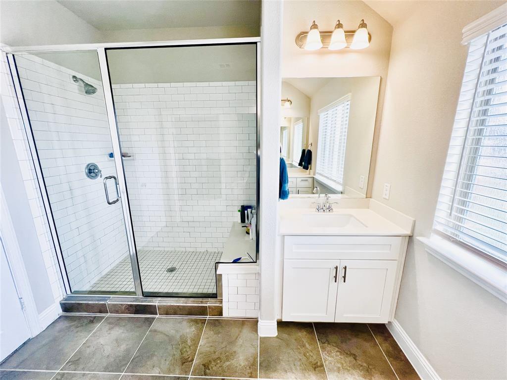 552 Sequoia Street Allen, TX 75002 - Photo 12 of 20 a bathroom with a sink and a mirror