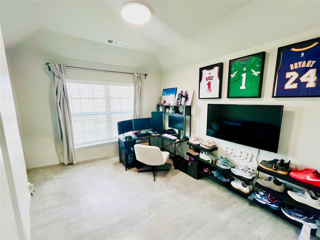 552 Sequoia Street Allen, TX 75002 - Photo 14 of 20 a living room with furniture and a flat screen tv