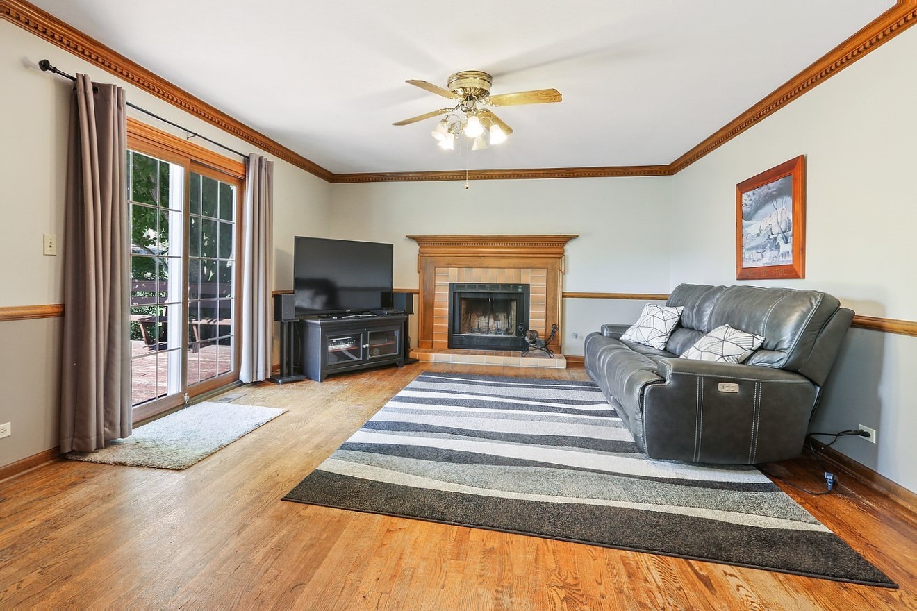 3582 Ronald Road Crete, IL 60417 - Photo 4 of 16 a living room with furniture and a fireplace