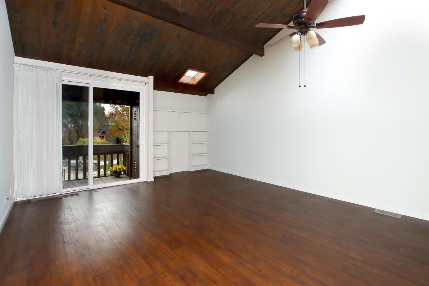 103 Shelter Lagoon Drive Santa Cruz, CA 95060 - Photo 12 of 39 an empty room with wooden floor and windows