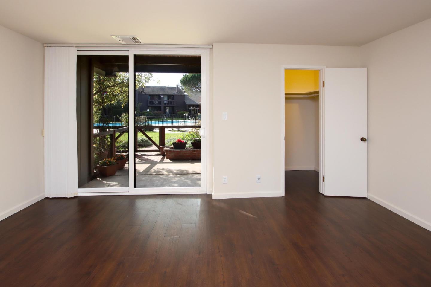 103 Shelter Lagoon Drive Santa Cruz, CA 95060 - Photo 18 of 39 an empty room with wooden floor and outdoor view