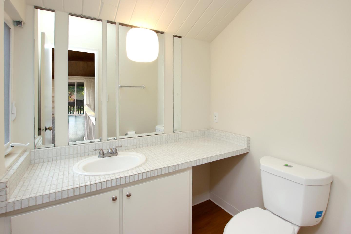 103 Shelter Lagoon Drive Santa Cruz, CA 95060 - Photo 22 of 39 a bathroom with a sink a toilet and shower