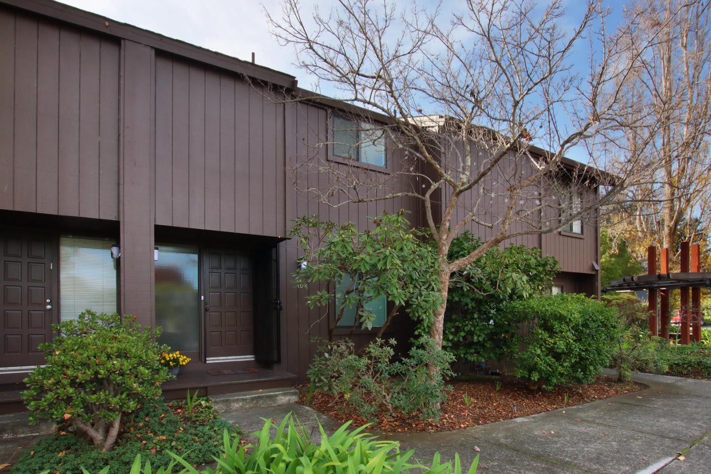 103 Shelter Lagoon Drive Santa Cruz, CA 95060 - Photo 26 of 39 a backyard of a house with plants and trees