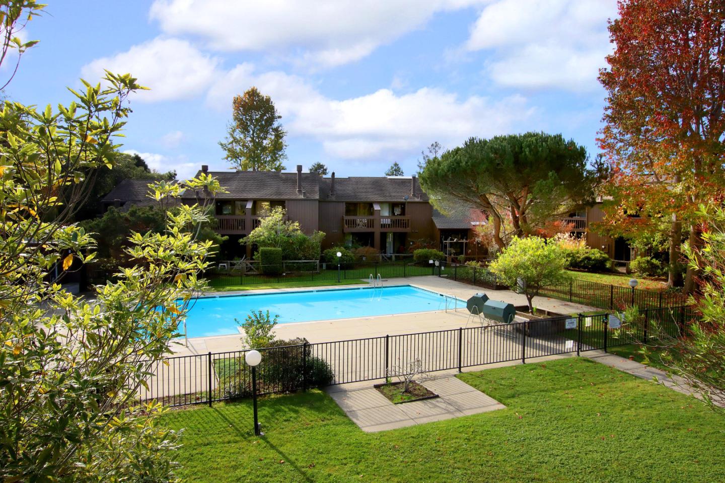 103 Shelter Lagoon Drive Santa Cruz, CA 95060 - Photo 4 of 39 a swimming pool with outdoor seating and garden