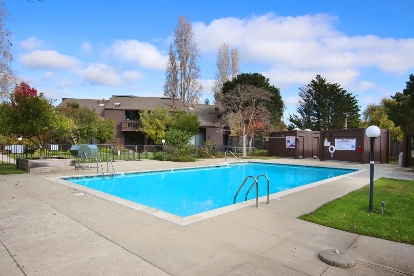 103 Shelter Lagoon Drive Santa Cruz, CA 95060 - Photo 36 of 39 a view of a swimming pool and a yard