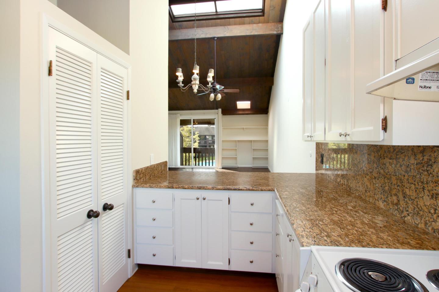 103 Shelter Lagoon Drive Santa Cruz, CA 95060 - Photo 7 of 39 a bathroom with a granite countertop sink and a mirror