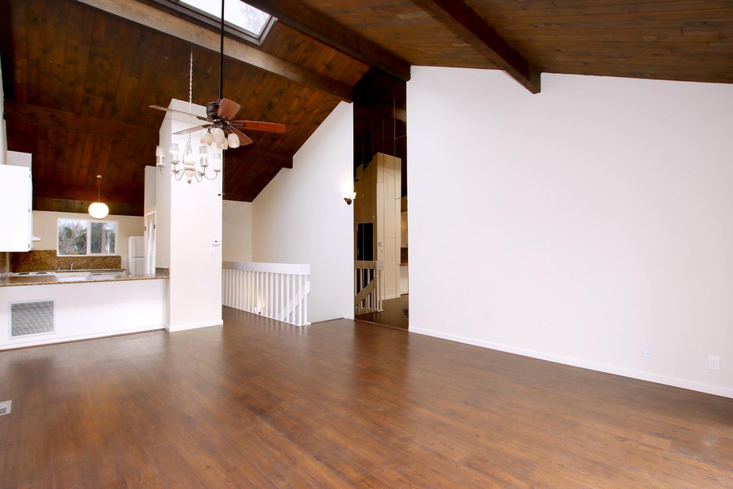 103 Shelter Lagoon Drive Santa Cruz, CA 95060 - Photo 9 of 39 a view of a hallway with wooden floor and staircase