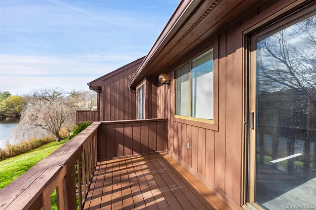 a view of balcony with wooden floor
