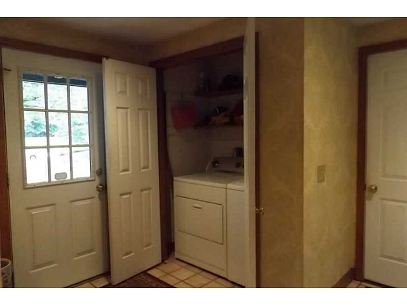 1140 High Hawk Road East Greenwich, RI 02818 - Photo 13 of 18 Mud Room. side entry large mud room with laundry, powder room access to garage and back yard.
