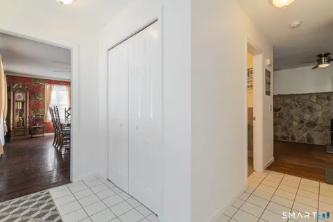 a view of a hallway view with three rooms