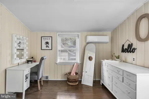 a view of a double vanity sink and a window