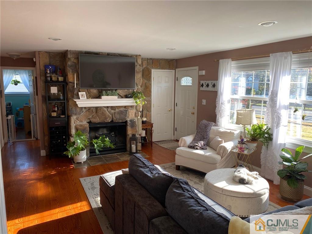 200 New Dover Road Colonia, NJ 07067 - Photo 5 of 14 a living room with furniture and a fireplace