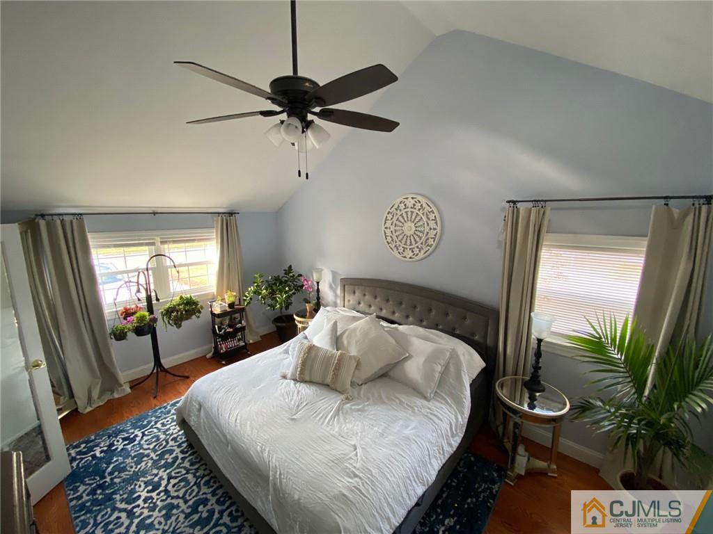 200 New Dover Road Colonia, NJ 07067 - Photo 9 of 14 a bedroom with a bed and wooden floor