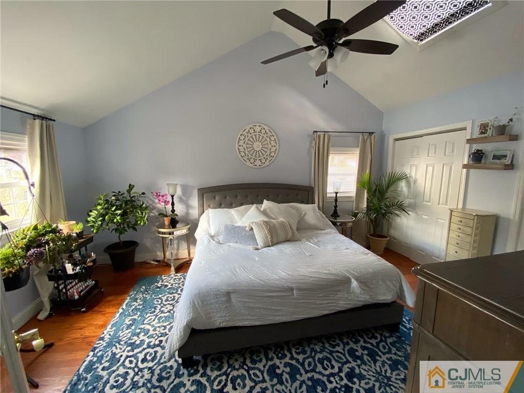 200 New Dover Road Colonia, NJ 07067 - Photo 10 of 14 a bedroom with a bed potted plant with the view of bathroom