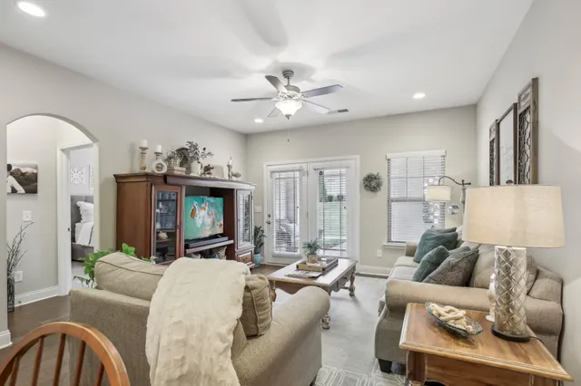 a living room with furniture and a fireplace