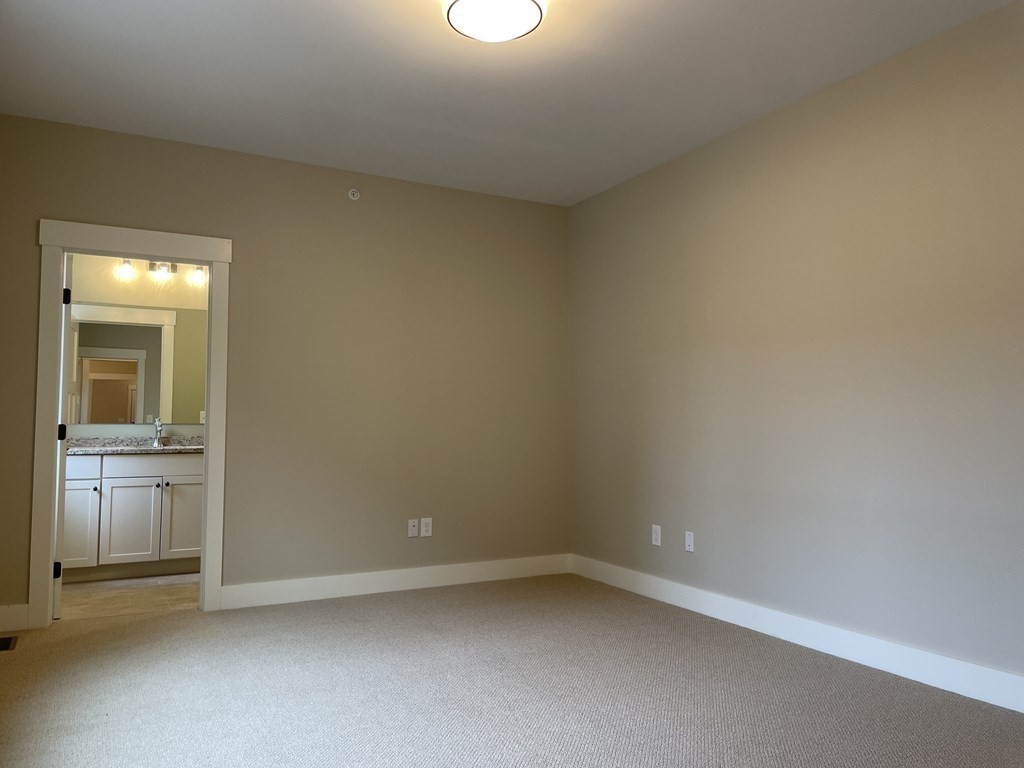 3 Powell Street, Unit B Devens, MA 01434 - Photo 12 of 28 wooden floor and cabinet in a room