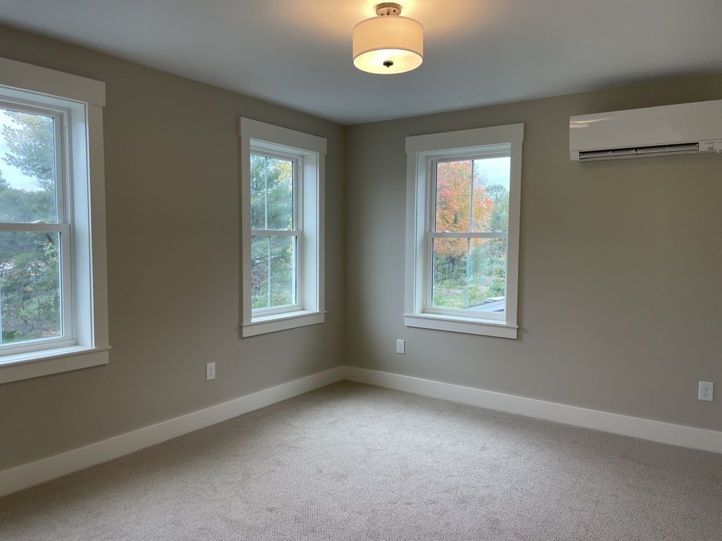 3 Powell Street, Unit B Devens, MA 01434 - Photo 18 of 28 a view of an empty room with windows