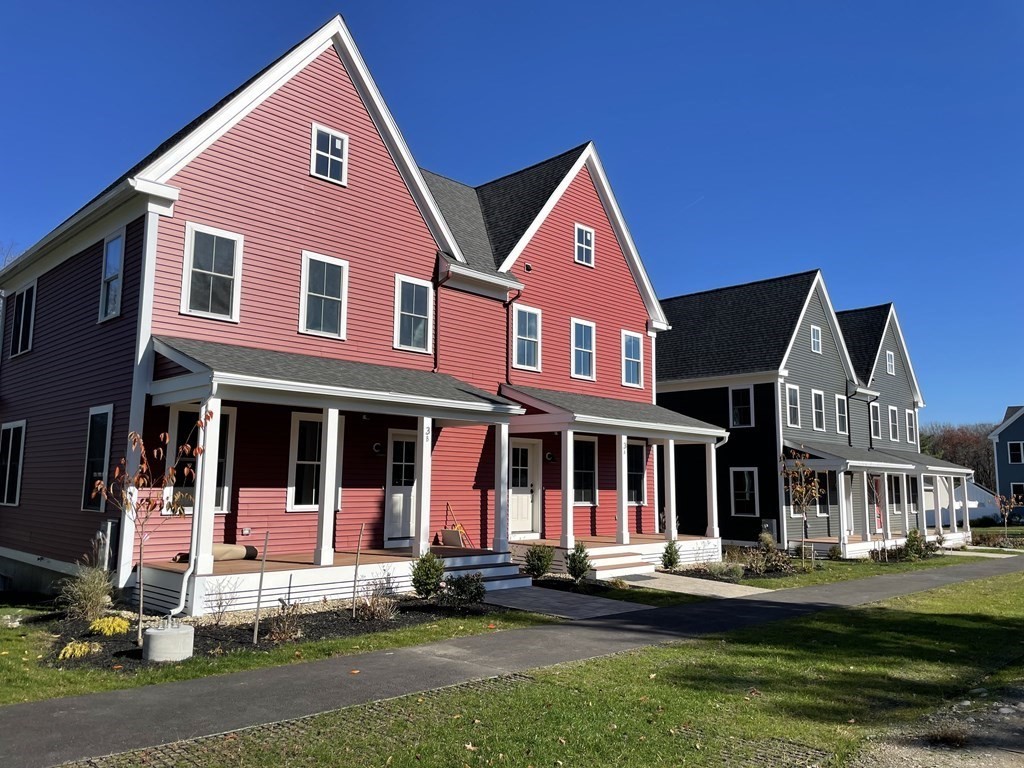 3 Powell Street, Unit B Devens, MA 01434 - Photo 2 of 28 front view of a house with a yard