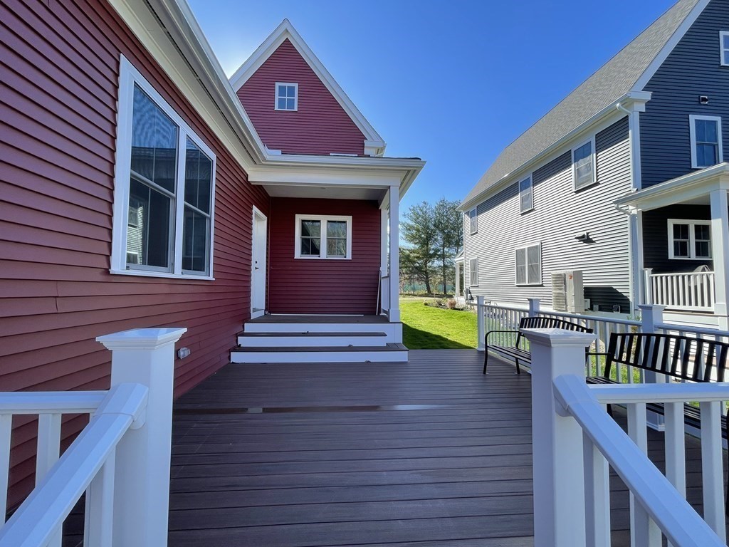 3 Powell Street, Unit B Devens, MA 01434 - Photo 27 of 28 a view of a house with a chairs and table in a patio
