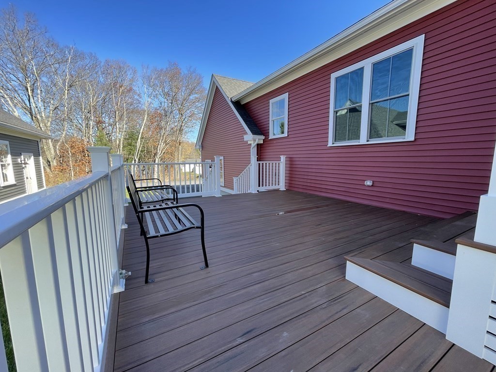 3 Powell Street, Unit B Devens, MA 01434 - Photo 28 of 28 a view of a wooden deck with a bench