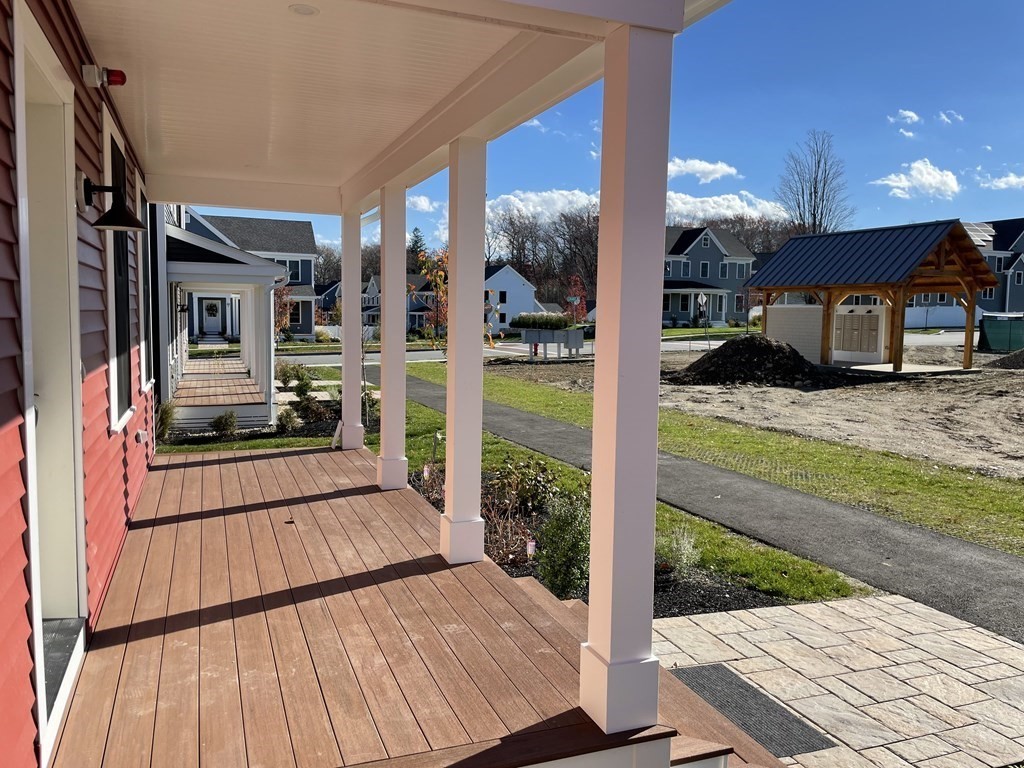 3 Powell Street, Unit B Devens, MA 01434 - Photo 3 of 28 a view of living room kitchen with furniture and wooden floor
