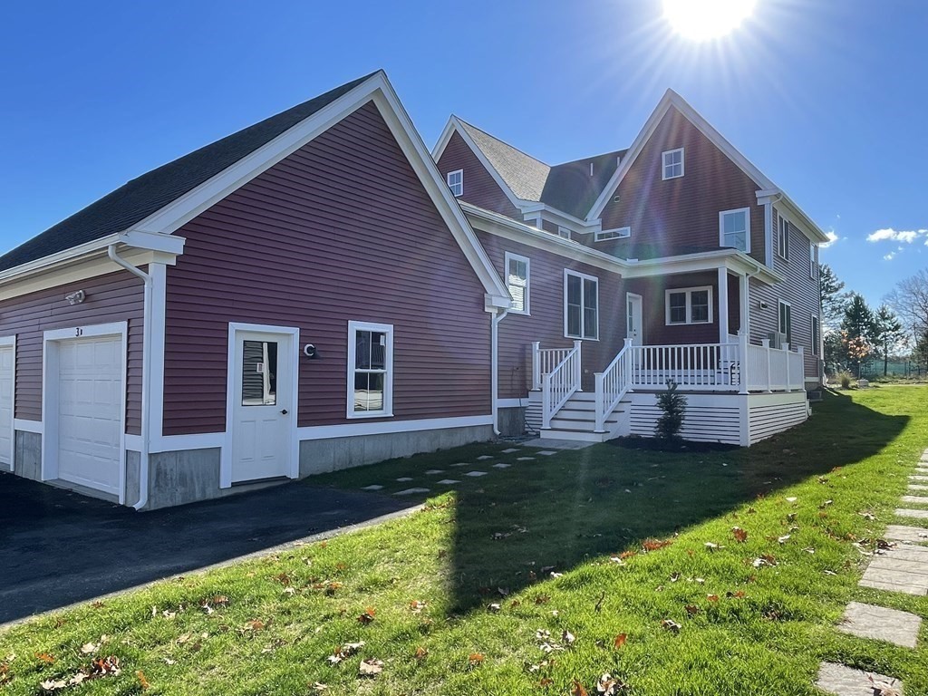 3 Powell Street, Unit B Devens, MA 01434 - Photo 4 of 28 a front view of house with yard and green space