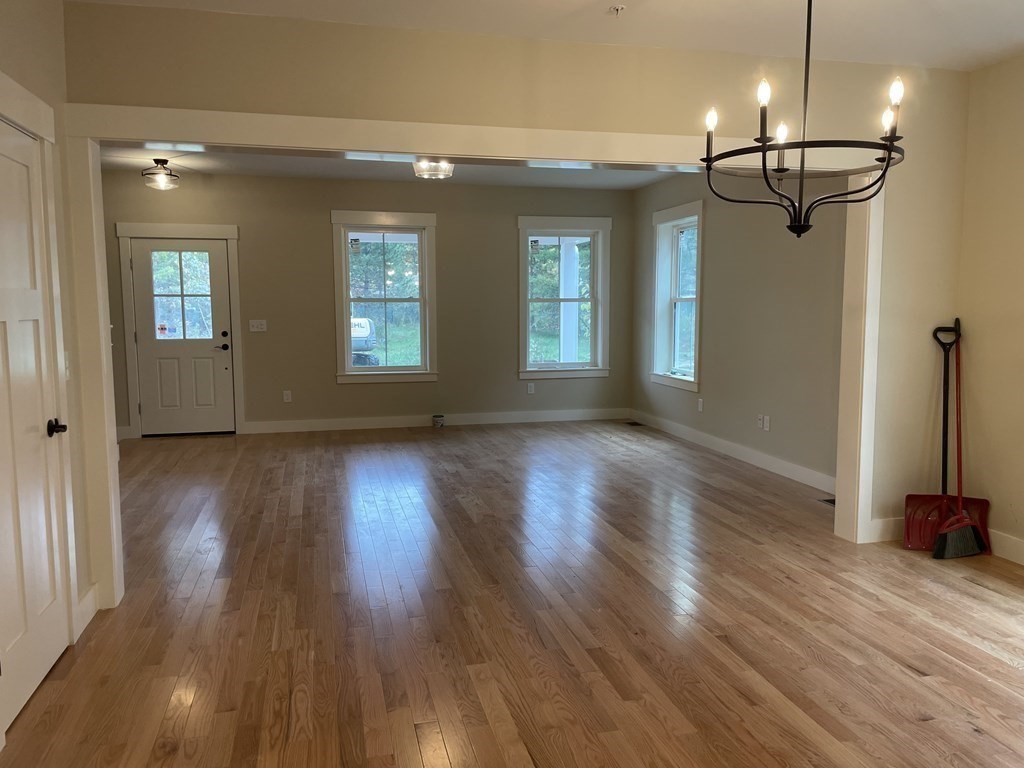 3 Powell Street, Unit B Devens, MA 01434 - Photo 6 of 28 a view of a room with wooden floor and window