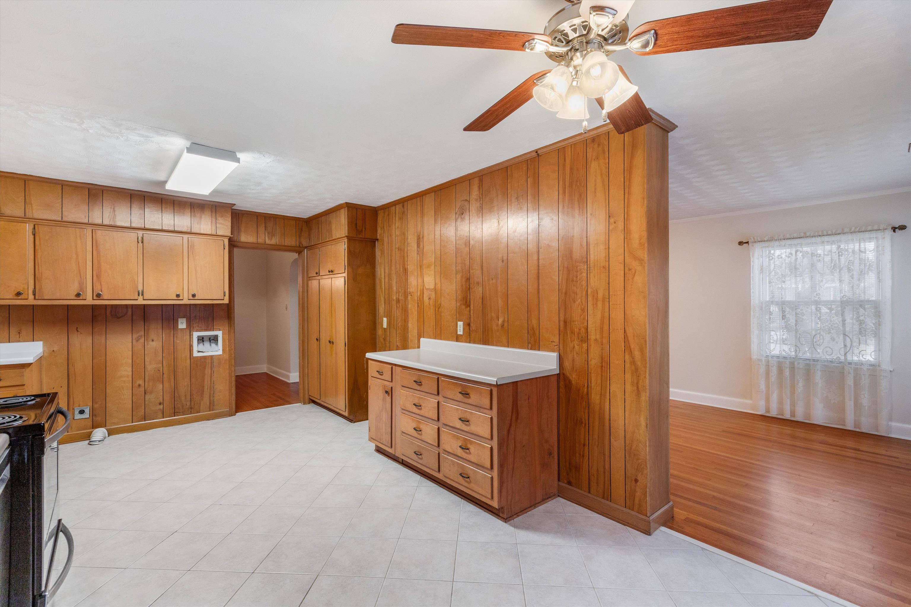 1217 Vaughn Road Memphis, TN 38122 - Photo 6 of 27 a view of an empty room with wooden floor and a window