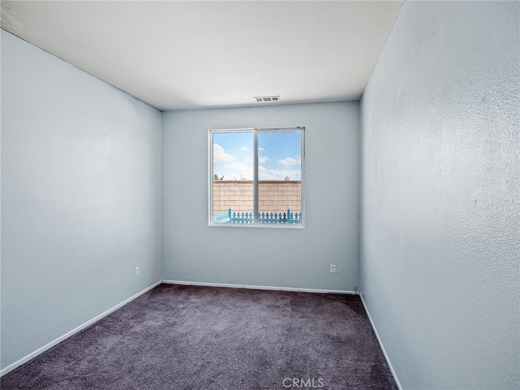 8923 Azalea Springs Road Oak Hills, CA 92344 - Photo 20 of 46 Downstairs Bedroom