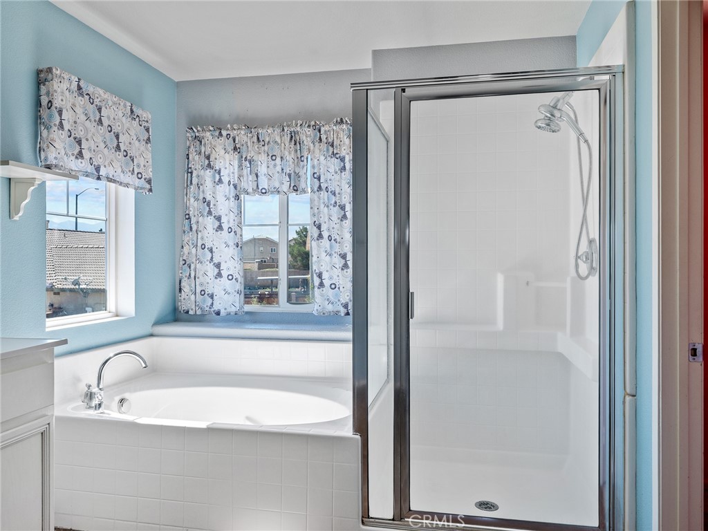 8923 Azalea Springs Road Oak Hills, CA 92344 - Photo 28 of 46 Primary Bath with Separate Tub and Shower