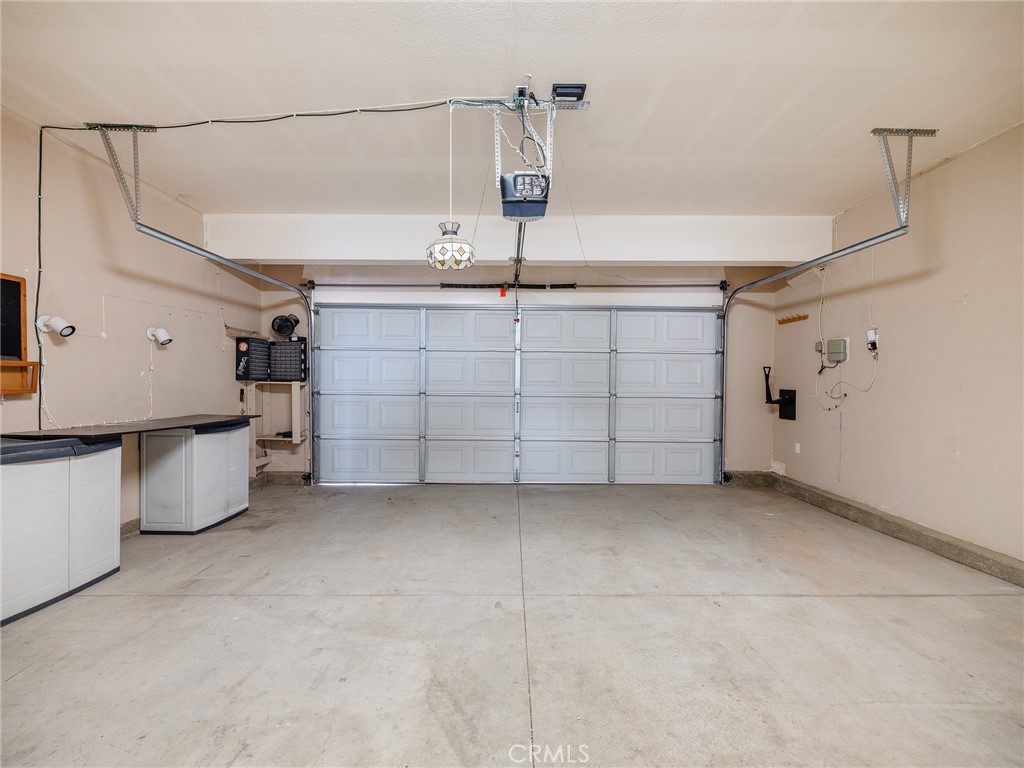 8923 Azalea Springs Road Oak Hills, CA 92344 - Photo 40 of 46 2-Car Attached Garage with Storage Containers