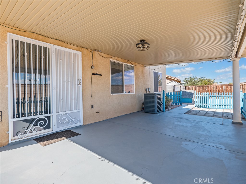 8923 Azalea Springs Road Oak Hills, CA 92344 - Photo 41 of 46 Slider to Back Covered Patio