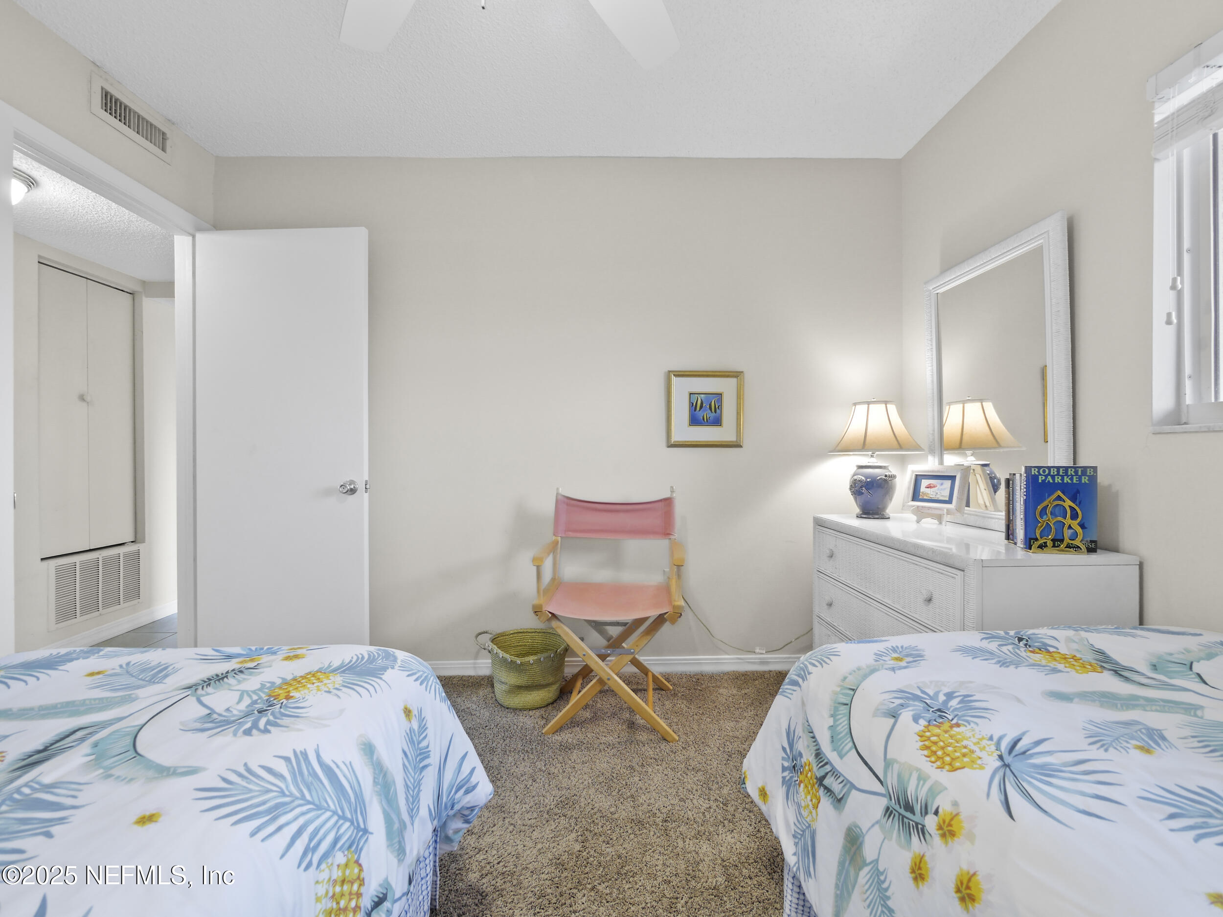 4 Ocean Trace Road, Unit 424 St. Augustine, FL 32080 - Photo 7 of 38 a bedroom with a bed and furniture