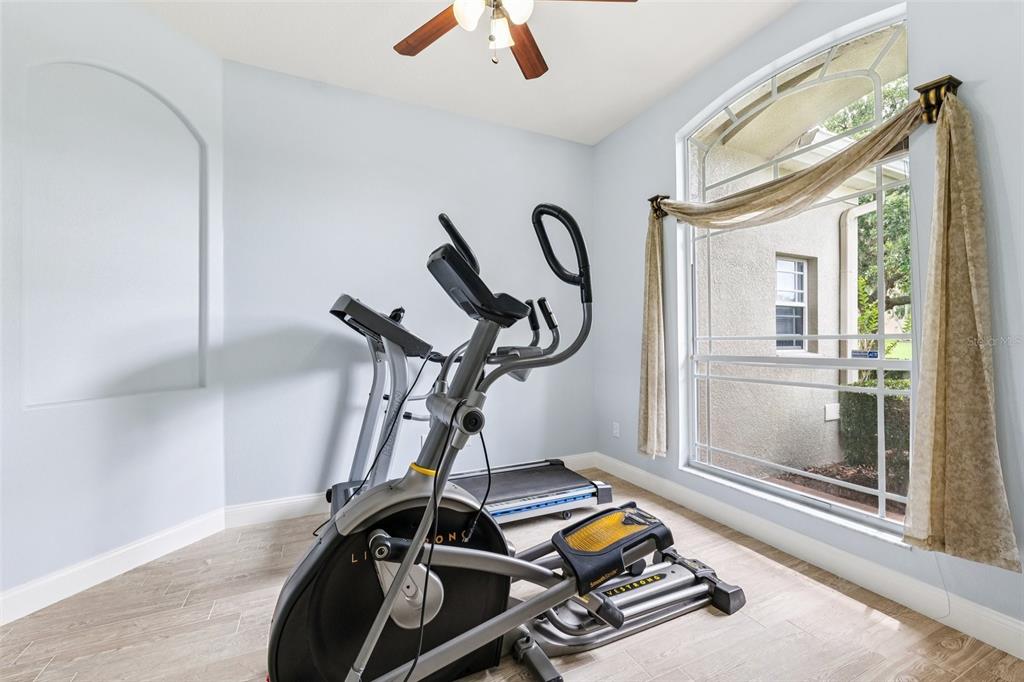 13049 Thoroughbred Drive Dade City, FL 33525 - Photo 28 of 52 a room with gym equipment
