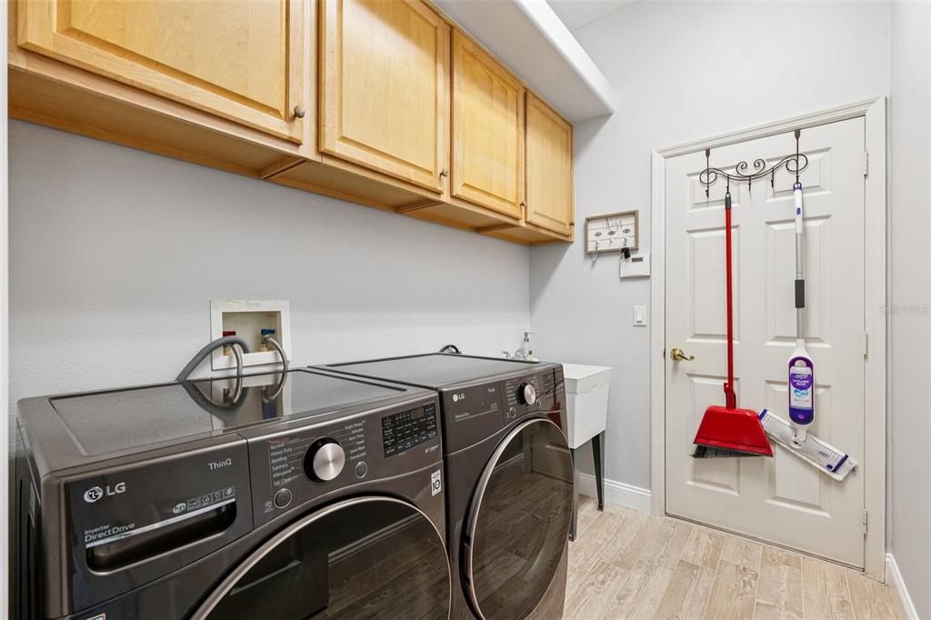 13049 Thoroughbred Drive Dade City, FL 33525 - Photo 33 of 52 a utility room with dryer and washer