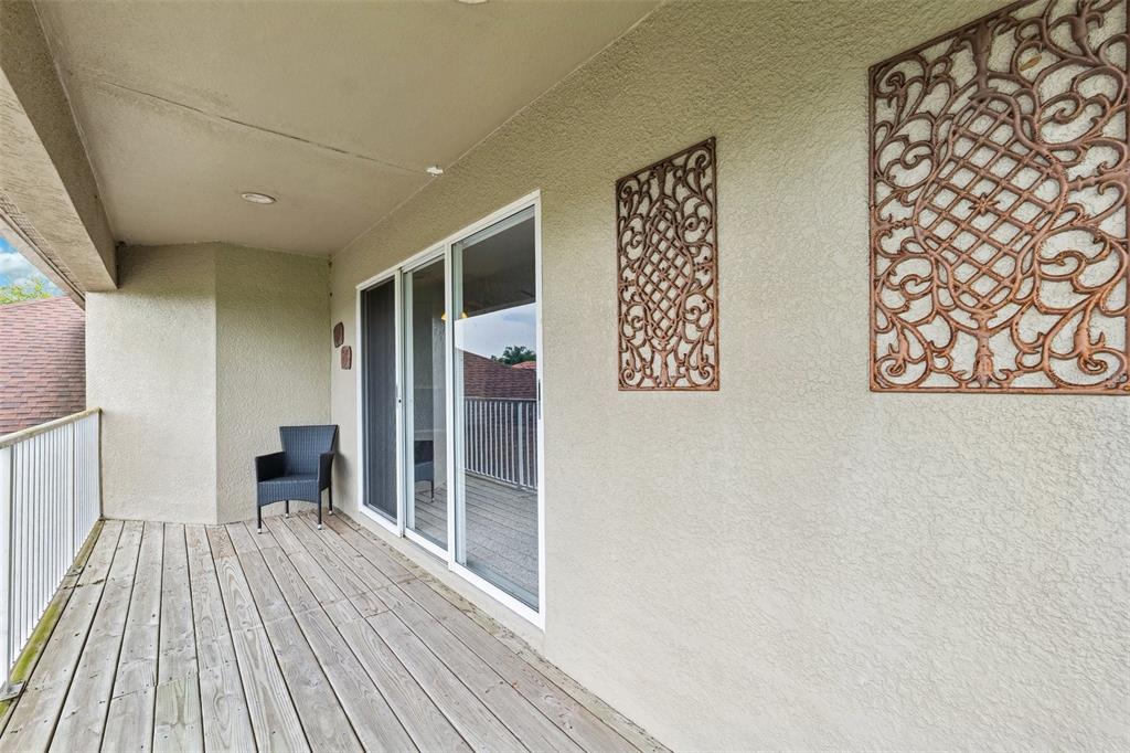 13049 Thoroughbred Drive Dade City, FL 33525 - Photo 35 of 52 a view of a room with wooden floor and furniture