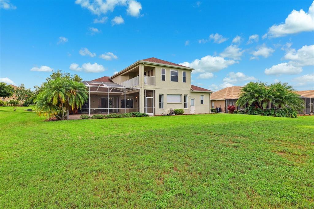 13049 Thoroughbred Drive Dade City, FL 33525 - Photo 40 of 52 a front view of a house with garden