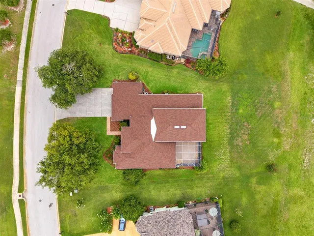 an aerial view of a house with a garden