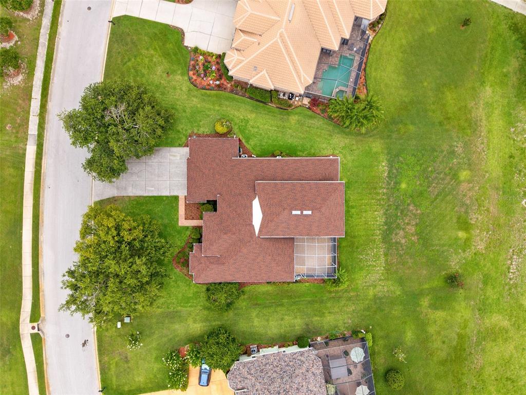 13049 Thoroughbred Drive Dade City, FL 33525 - Photo 42 of 52 an aerial view of a house with a garden