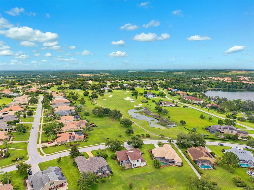 13049 Thoroughbred Drive Dade City, FL 33525 - Photo 45 of 52 an aerial view of residential houses with outdoor space