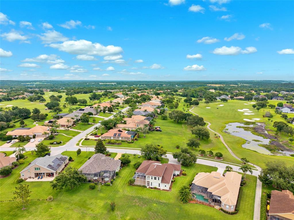 13049 Thoroughbred Drive Dade City, FL 33525 - Photo 46 of 52 an aerial view of residential houses with outdoor space