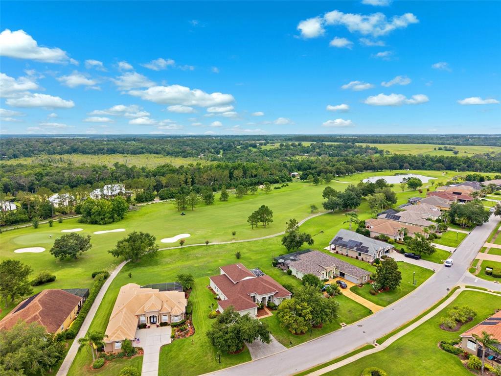 13049 Thoroughbred Drive Dade City, FL 33525 - Photo 49 of 52 an aerial view of residential houses with outdoor space and street view
