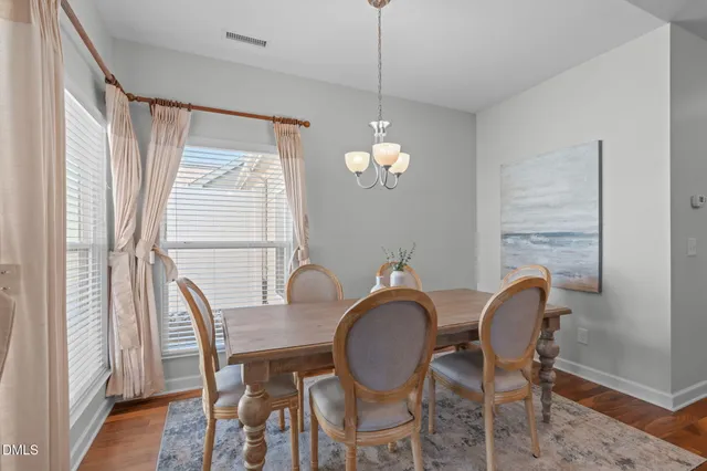 a kitchen with stainless steel appliances granite countertop a kitchen island a stove a refrigerator a sink and a cabinets