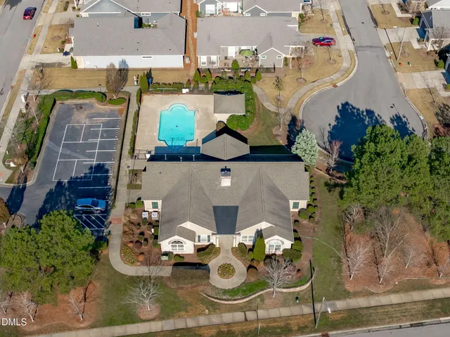 an aerial view of a house with a swimming pool