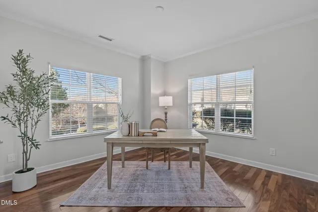 a living room with fireplace furniture and a wooden floor