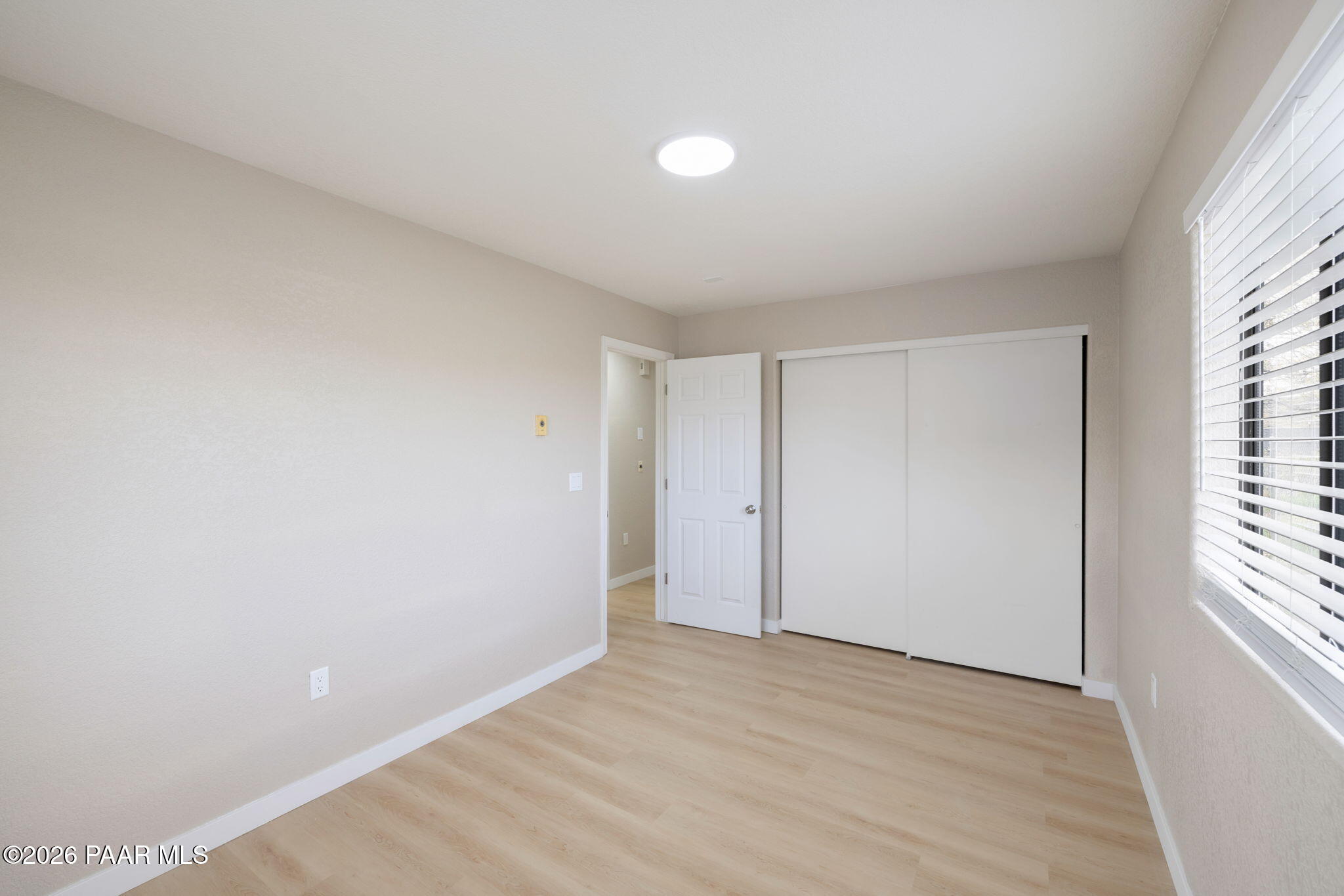 20102 East Antelope Road Mayer, AZ 86333 - Photo 18 of 24 a view of an empty room with a window