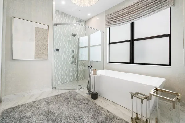 a bathroom with a bathtub and a shower
